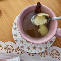 Chá da casa: lemon peel, cinnamon stick, ginger slices (no honey sweetener) at Cake Boutique in Setubal