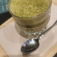 Mango matcha latte elixir with oat milk at Cafe Frei in Budapest