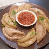 Broccoli-shiitaki-tofu and potato-cabbage-carrot fillings with mitho dip steamed dumplings at Daily Dumpling in Berlin