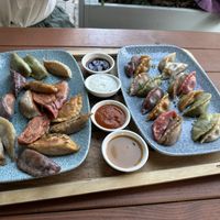 Dumplings! Fried on the left and steamed on the right  at Momos - Organic Veggie Dumplings in Berlin