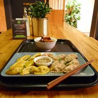 Two different dumplings with soy-dip at Momos - Organic Veggie Dumplings in Berlin