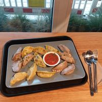 Medium portion (14 dumplings), two types of vegan dumpling: brocolli & shiitake mushroom and pumpkin & chickpea, mitho tomato dip.  at Momos - Organic Veggie Dumplings in Berlin