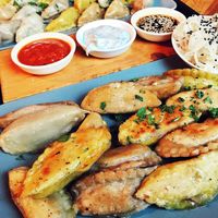 we got the “Momo’s Experience” - half fried, half steamed, all 4 fillings and 3 sauces. Plus a side of the fermented radish salad at Momos - Organic Veggie Dumplings in Berlin