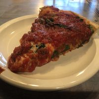 Traditional deep dish with spinach at Kitchen 17 in Chicago
