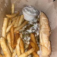 Philly cheesesteak and fries  at Kitchen 17 in Chicago