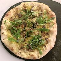 Vegan pizza, "la truffe", olive oil base, truffle cream, mushrooms, shredded vegetables, arugula at La Pizza de Nico in Paris