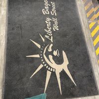 Floor mat  at Liberty Bagels - Wall Street in New York City