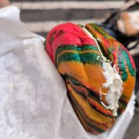 Rainbow bagel with tofu spinach and artichoke at Liberty Bagels - Wall Street in New York City