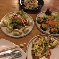 Spring rolls, sushi, mushroom pizza & zoodles at Rasayana Raw Food Cafe in Bangkok