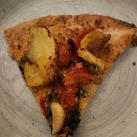 Vegan broccolini and potato pizza (cauliflower crust, cashew cheese, toppings - roasted broccolini, crushed potato, calabrian chilies, tomato, and rosemary) at Sixty Vines in Plano