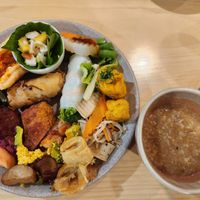 Porridge, fruit spring rolls, cakes, rolls, tofu at Homie Vegan in Hanoi