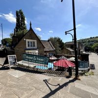 Building is the old Porter’s Lodge, built 1837. One back window even has bars on it from back when it was a prison cell!  at Roast & Toast Cafe in Sowerby Bridge