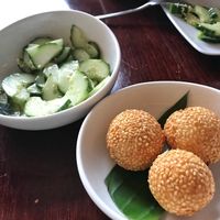 Cucumber salad, sesame sticky rice balls with sweet filling - all vegan at Leaf Vegetarian in Rotterdam