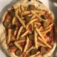 pizza “tedesca”: vegan wurstel, fries, vegan mozzarella and tomato sauce   at Pizzeria Vesuvio in Moncalieri