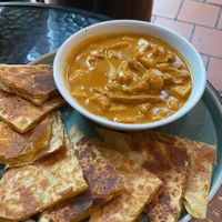 Roti canai with potato and soy chunks  at September Vegan Food in Wellington
