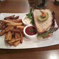 Bean burger and chips with tomato ketchup and sour cream dip at Katzentempel - München in Munich
