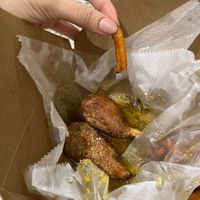Lemon pepper vegan wings with sweet potato fries.  at ON THE RUN Vegan in Miami