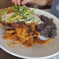 Chilaquiles rojo con huevo at Cafeteria Veggie Carimbó in Playa Zipolite