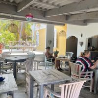 Outdoor yet covered seating  at Isabelle Off The Beach in Westpunt