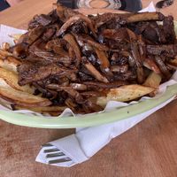 Vegan chorrillana with seitan and mushrooms  at Cerveza Rebelion in Chile Chico