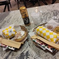 Medusa bagel 🥯 with banana cinnamon roll and godfather sub with quiche at Village Farmacy  in Poland