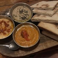 Aegean Trilogy- red pepper dip, baba ganoush, hummus and pita  at Mandarina Seaside Restaurant in Holbox