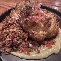Cauliflower  steak on avocado mousse served with rice and beans  at Mandarina Seaside Restaurant in Holbox