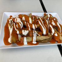 Patatas Bravas - more like potato wedges in a spicy sauce, but delicious!  at Coma Tapas & Punto in Huelva