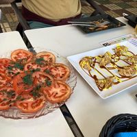 Tomato salad and gyozas (sauce on vegetable gyozas tasted a little like salted caramel, quite sweet)  at Coma Tapas & Punto in Huelva
