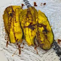 Aubergine fried in batter - batter tasted like it was based on chickpea flour, covered in what tasted like maple syrup. Very delicious.  at Coma Tapas & Punto in Huelva