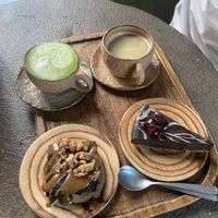 Mocha brownie, chocolate tart, oat milk matcha and americano  at Honest Greens - Las Ramblas in Barcelona