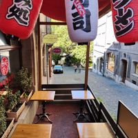 Outdoor seating at Omusubi Café in Geneva