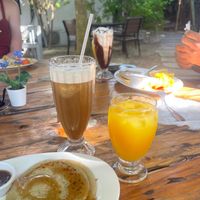 Pancakes, juice,  iced coffee vegan in front, iced coffee cowmilk/whipcream behind at Riviera Punta Cana in Punta Cana