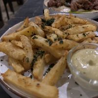Hand cut chips seasoned with toasted curry leafves  at Smoke & Bitters in Dikwella