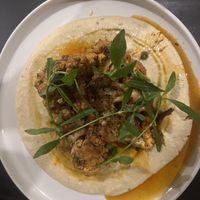 Cauliflower steak served over chickpea puree with chimichurri  at Hideout Lounge in Kandy