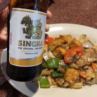 Drunken noodle with fried tofu, and singha 🩵  at Royal YUM in Denton