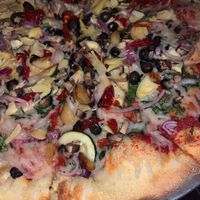 We got the veggie pizza but with vegan cheese and added artichokes. Some of the best pizza I’ve ever had for real!!!! at Cogans in Norfolk