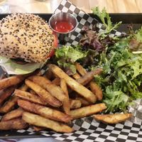 Burger, fries, and salad! All were delicious! at Invitation V in Montreal