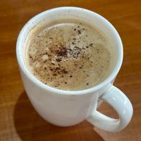 Cappuccino with oat milk   at Roots Bakery & Cafe in Samara