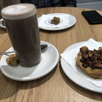 Vegan chocolate milk and vegan bun  at ARKET Cafe in Riga