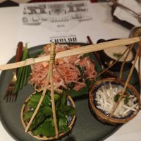 Lovely presentation of traditional rice noodle dish at Vegan Mahanakhon in Bangkok