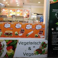 store front displaying the menu at Cigköftem - Karl Marx in Berlin