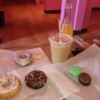 Donuts, macarons, and a vanilla iced latte at Café Mas in Chicago