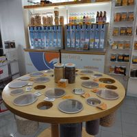 Bulk section with e.g. beans, and taps with wine at Negozio Leggero   in Turin
