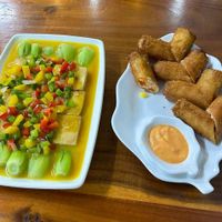 Left, tofu with pineapple sauce. Right, spring rolls at Kiều Đàm in Ho Chi Minh City