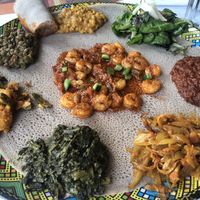 This is the vegetarian sampler with the shrimp appetizer in the middle….  at Enjera in Arlington