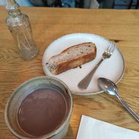 Very nice and cosy coffee! Vegan milk options and I ordered a vegan banana bread, très bon 😋🥧 at ARTA Café in Dusseldorf