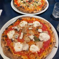 Quattro fromaggio and parmigiana pizzas  at Meow Pizzeria Verde in Innsbruck