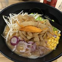 Ramen in miso broth with corn, spring onions, vegetables and edamame  at Ramen Shop in Strasbourg