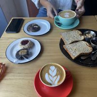 Flat white with almond milk, toast with peanut butter and artesanal jam, vegan cookies  at Negro Mercado in Tandil